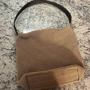The Sak crocheted beige tan hobo purse with leather strap.